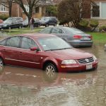 car stuck in flooded street